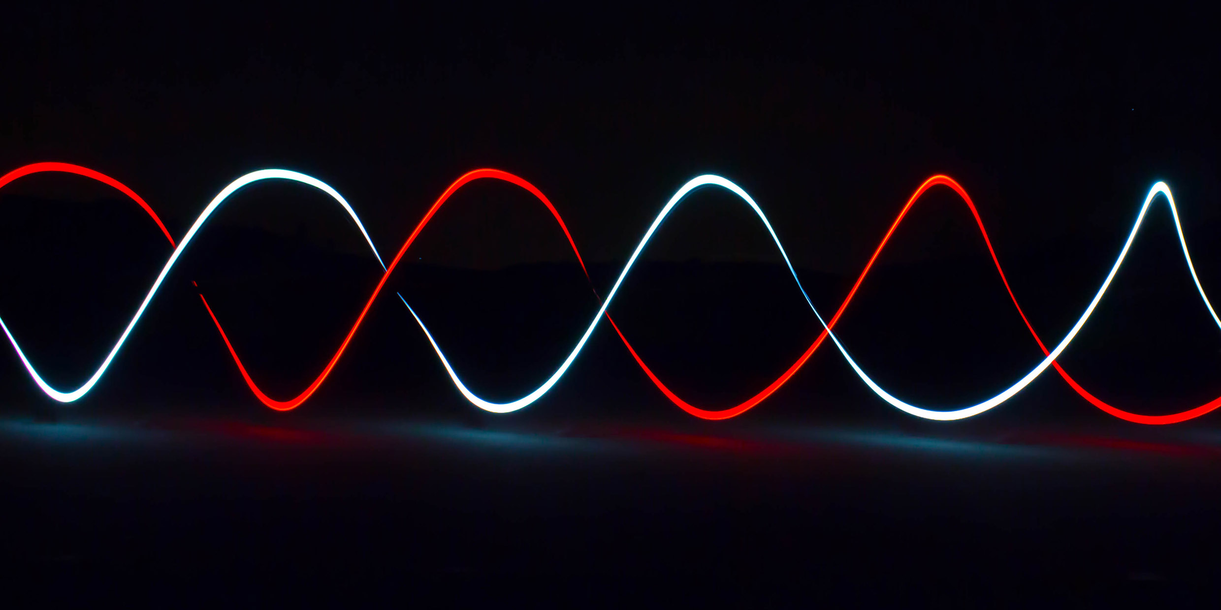 Image of double helix of glowing light