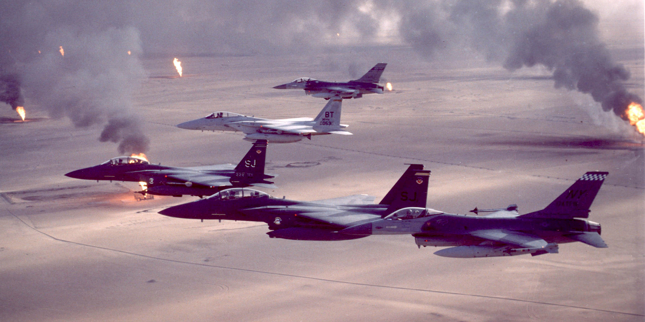 Image of fighter jets flying over desert