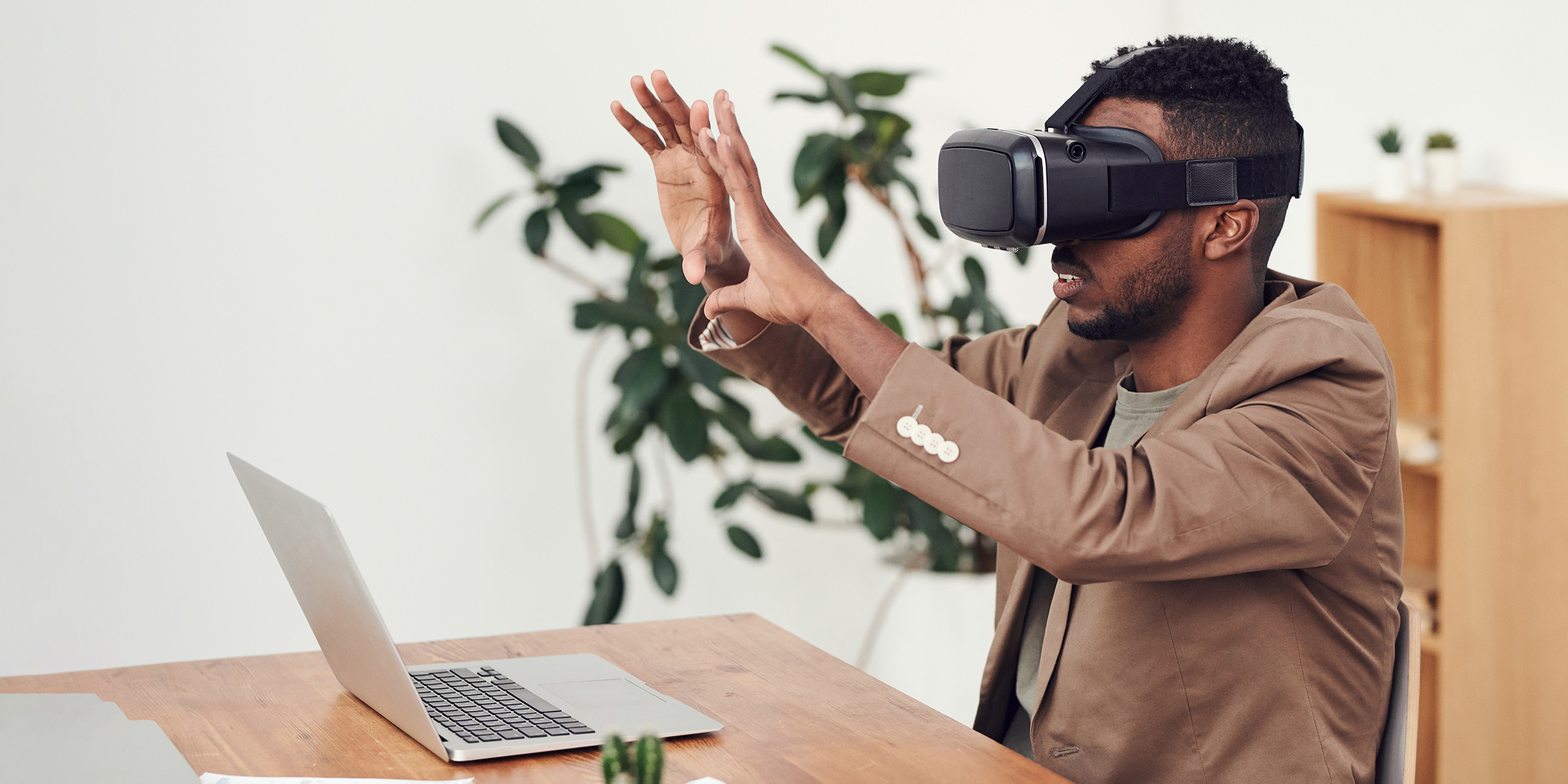 Image of young man wearing VR goggles
