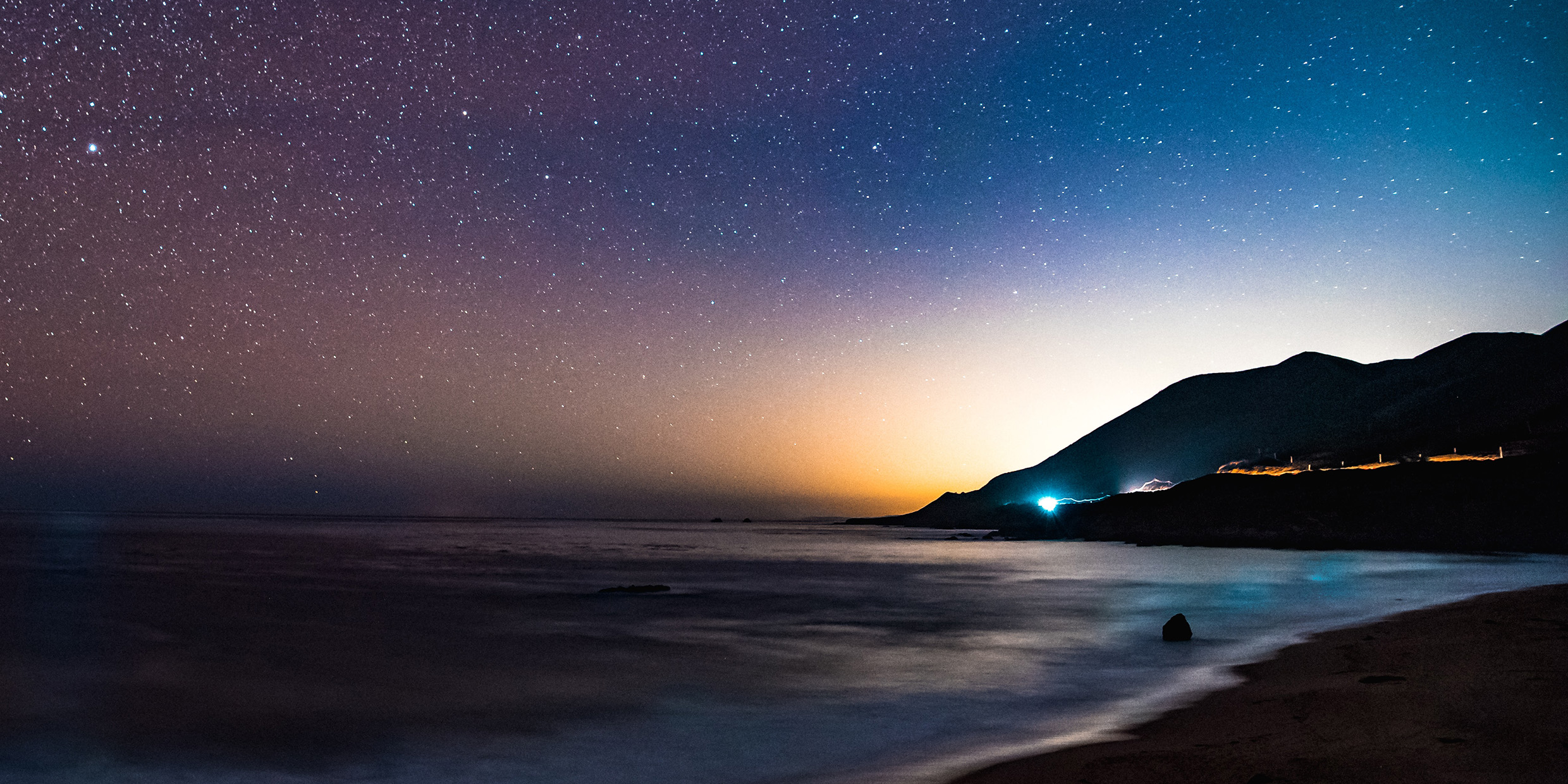 Nighttime view of the stars over the ocean