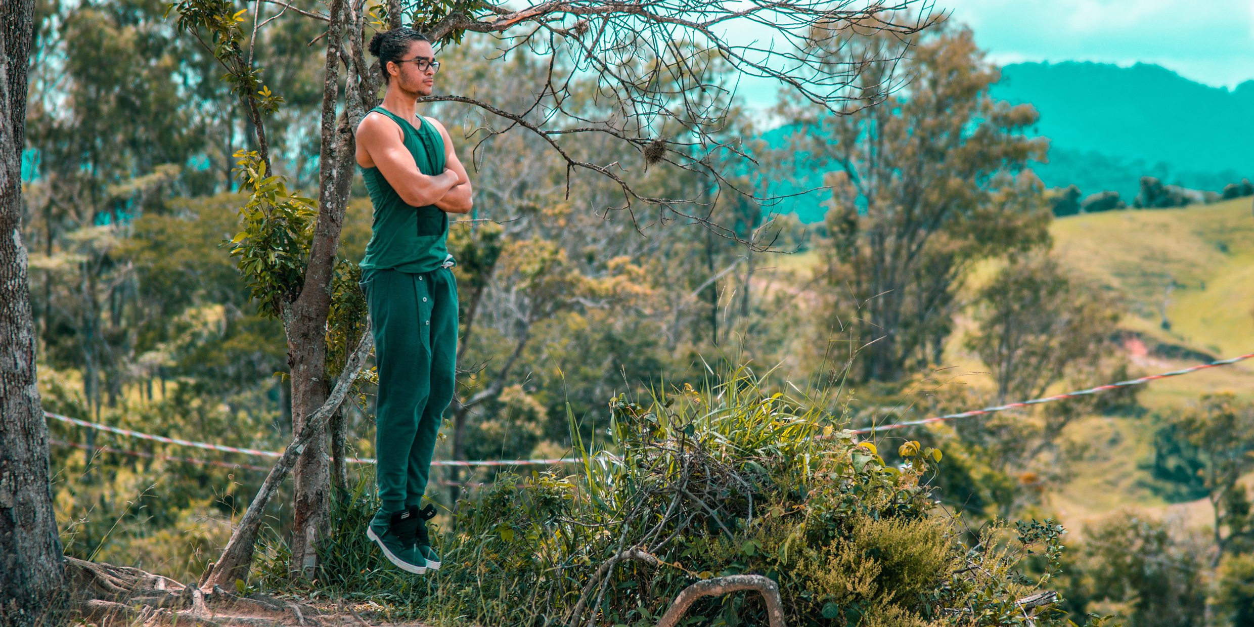 Freeze frame image of young man floating above the ground