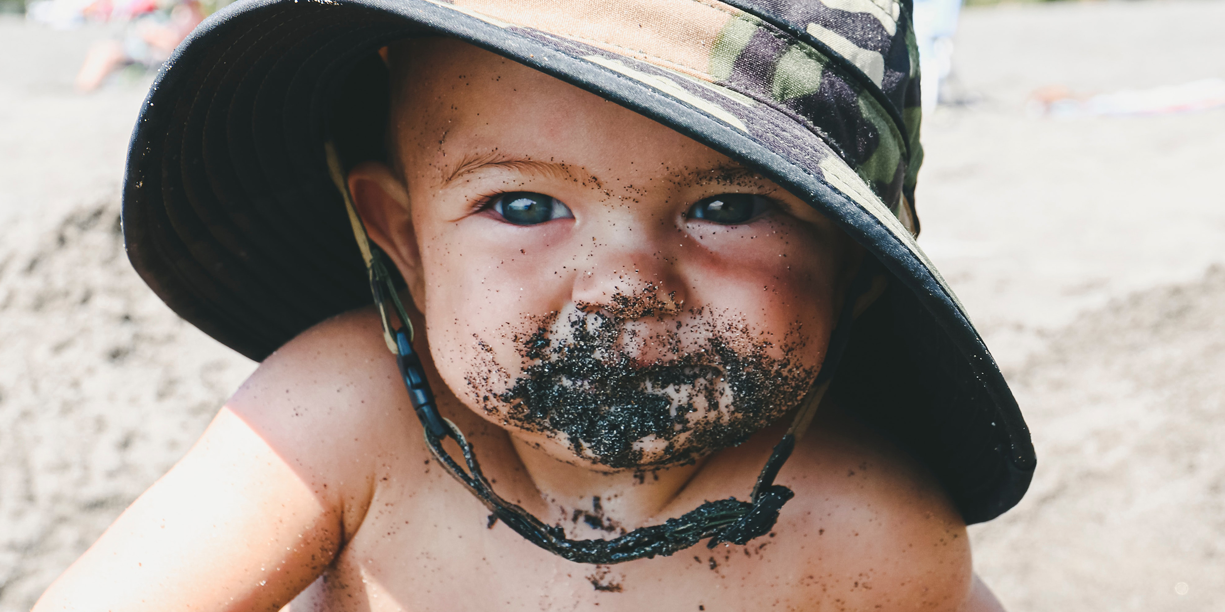 Image of infant with dirt all over face