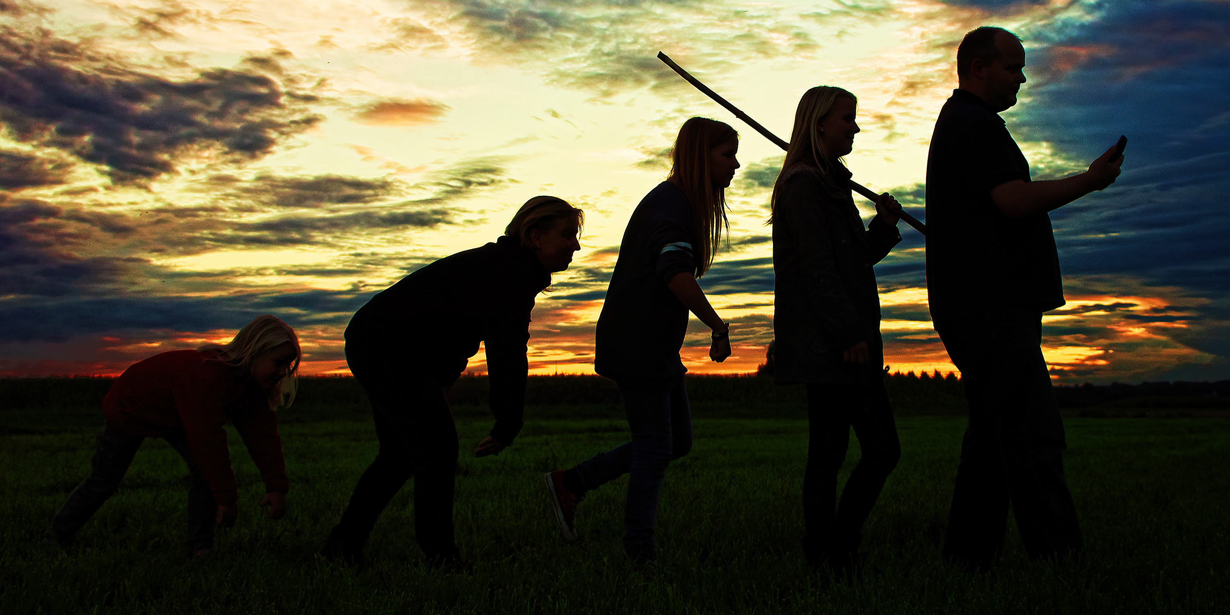 Image of silhouetted figures mimicking the traditional view of human evolution as progress from crouched to upright