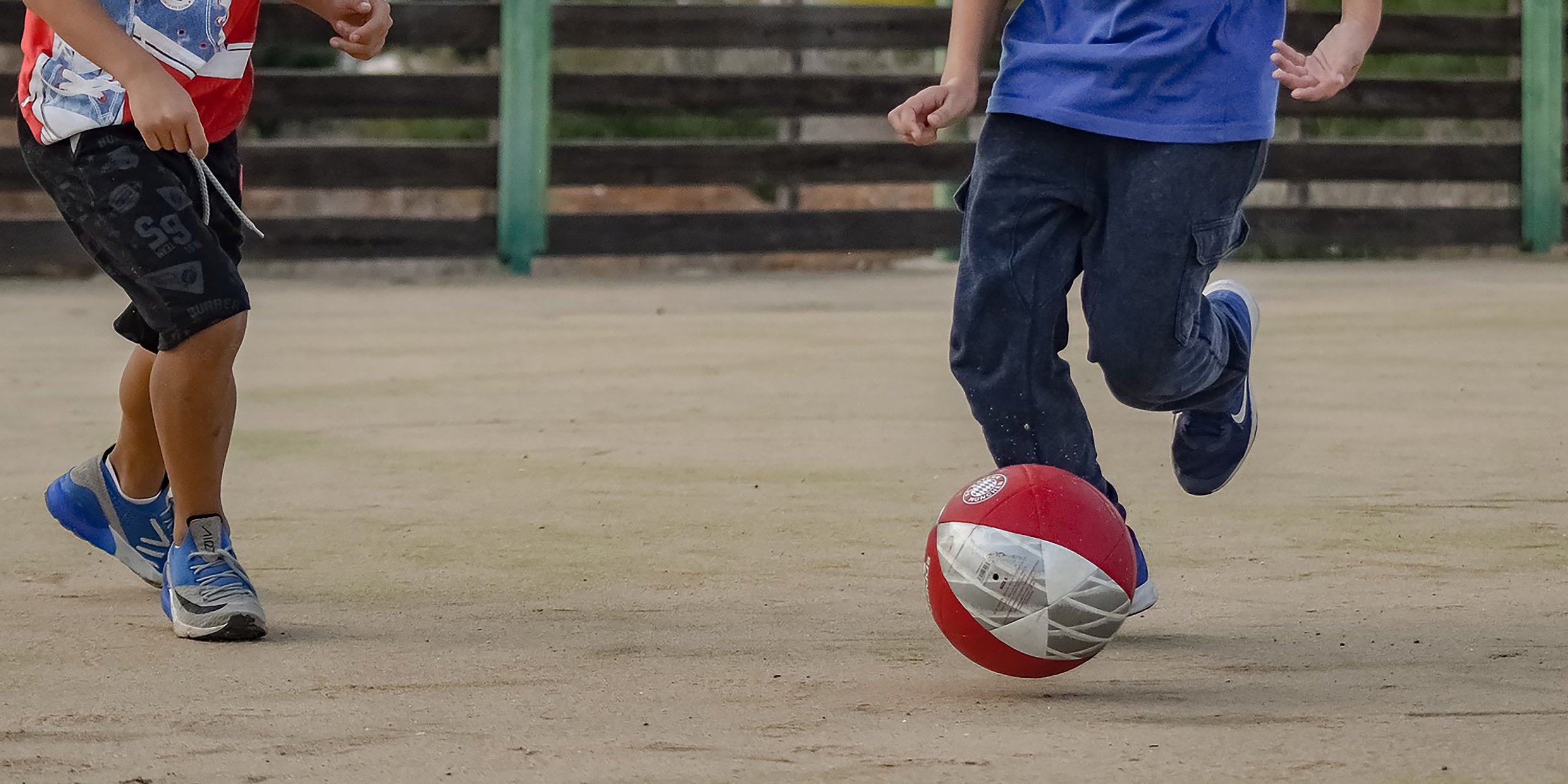 Image of children playing with soccer ball