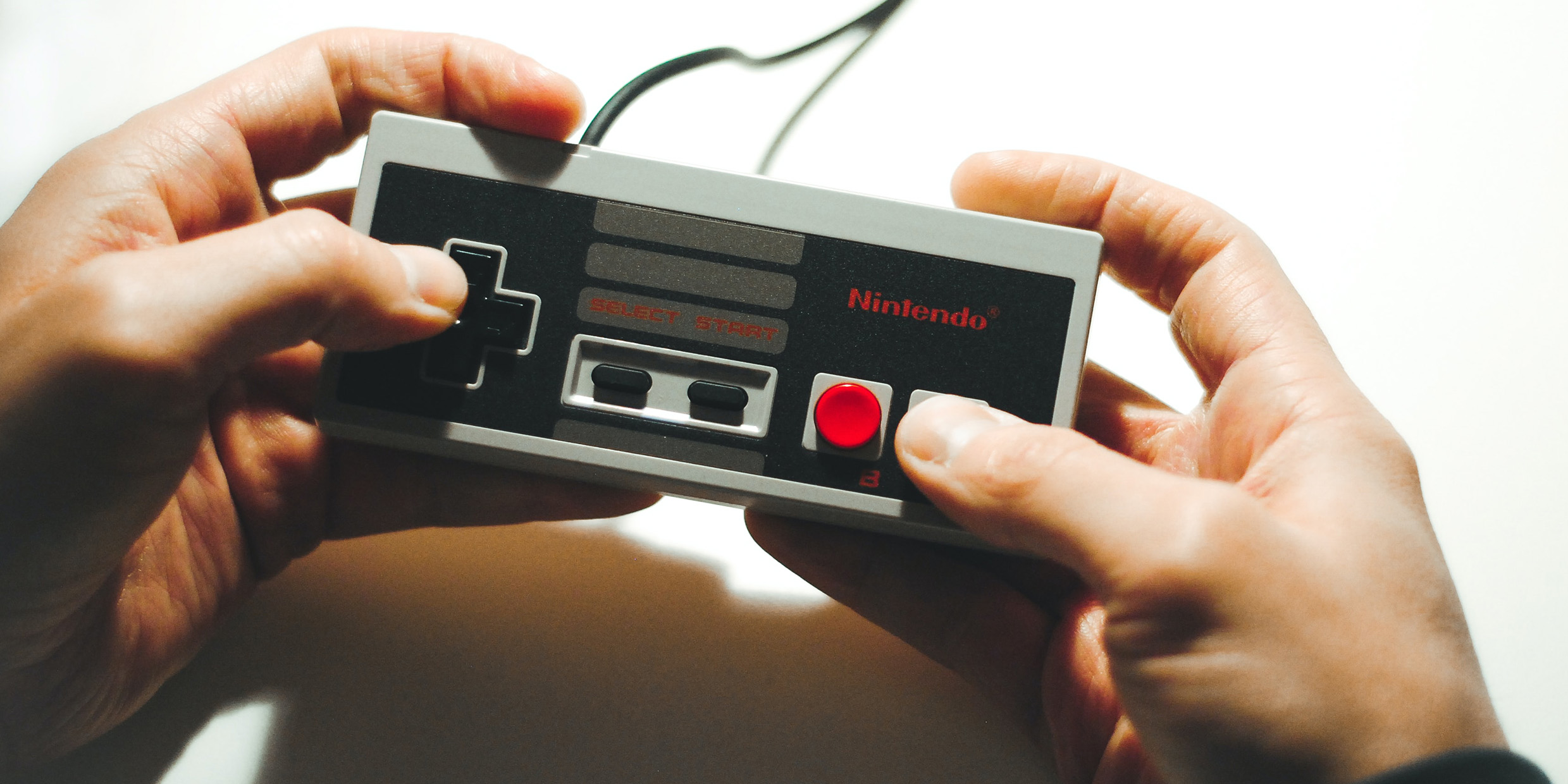 Image of a pair of hands holding a game controller