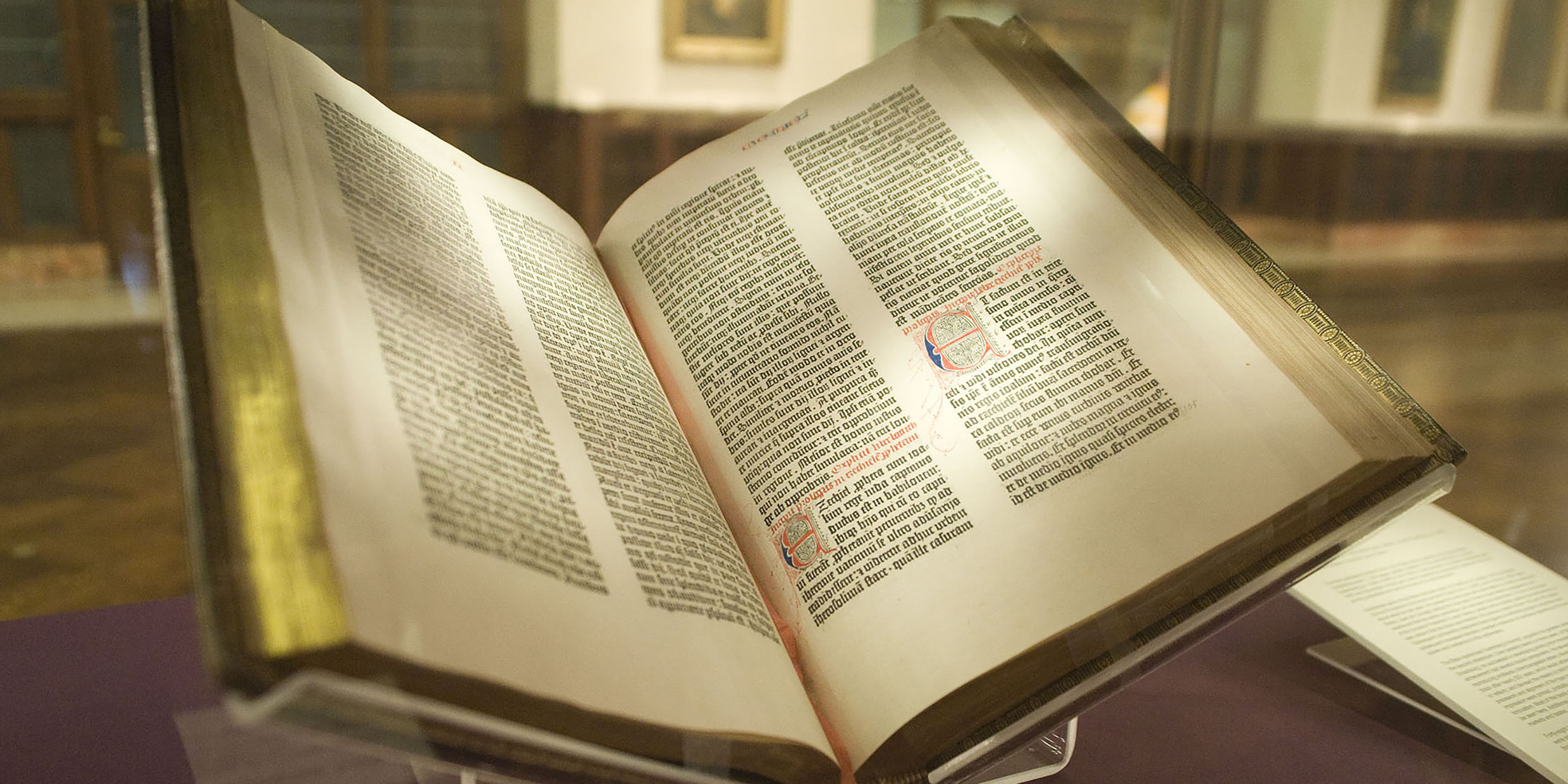 Image of a Gutenberg Bible laying open in a display case