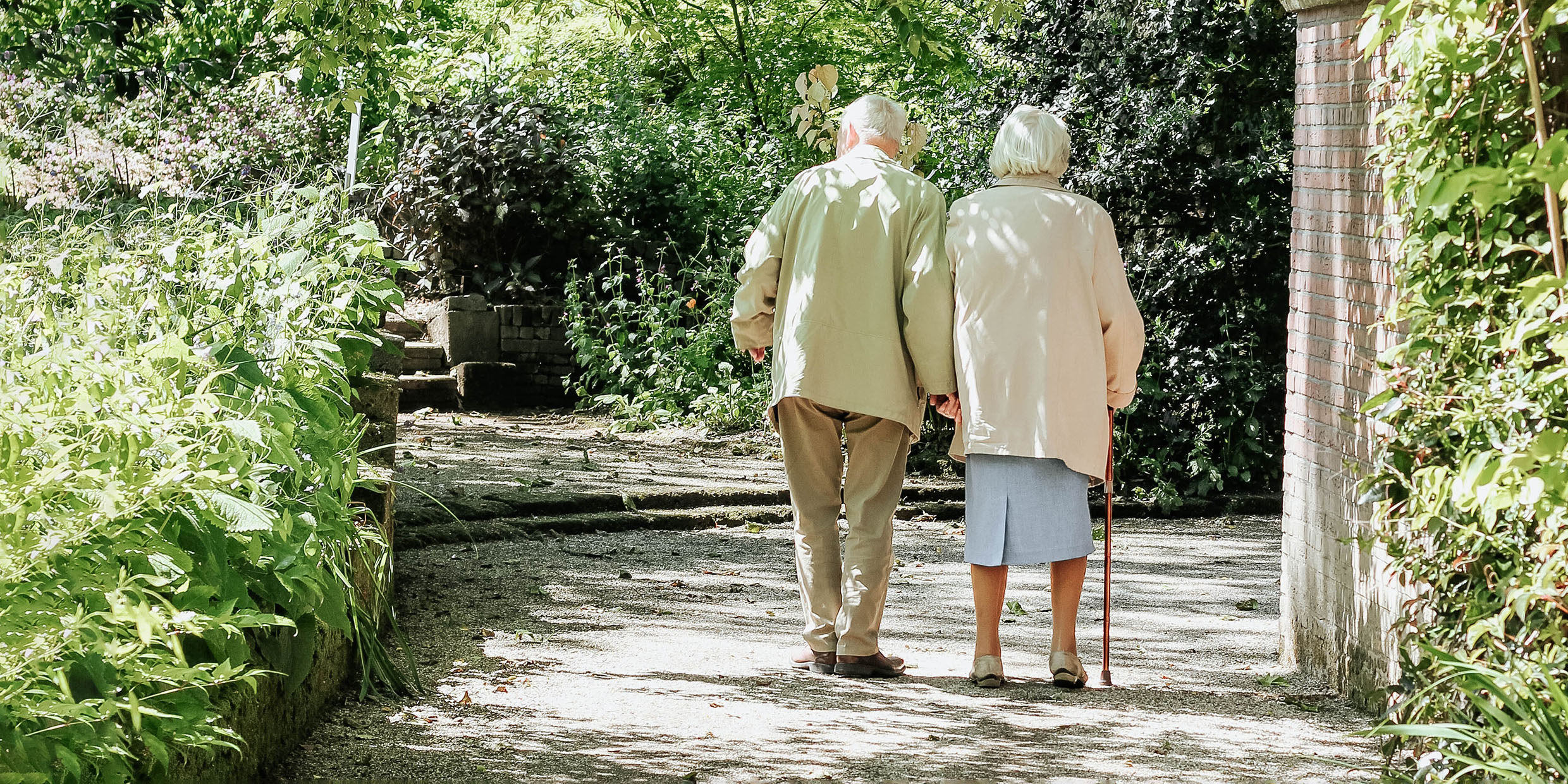 Photo of an elderly couple walking together