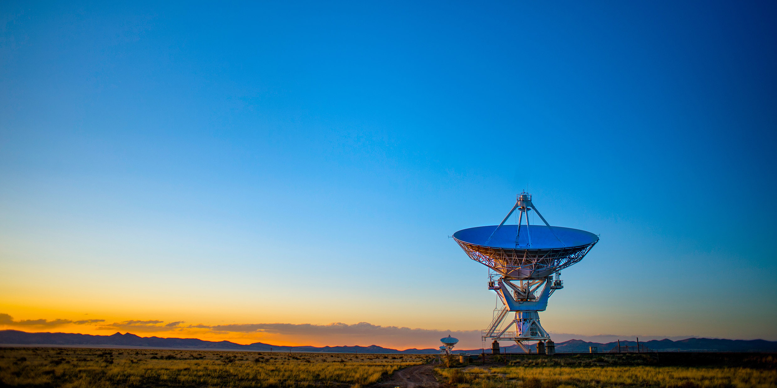 Image of a radio telescope pointing upwards at the sky