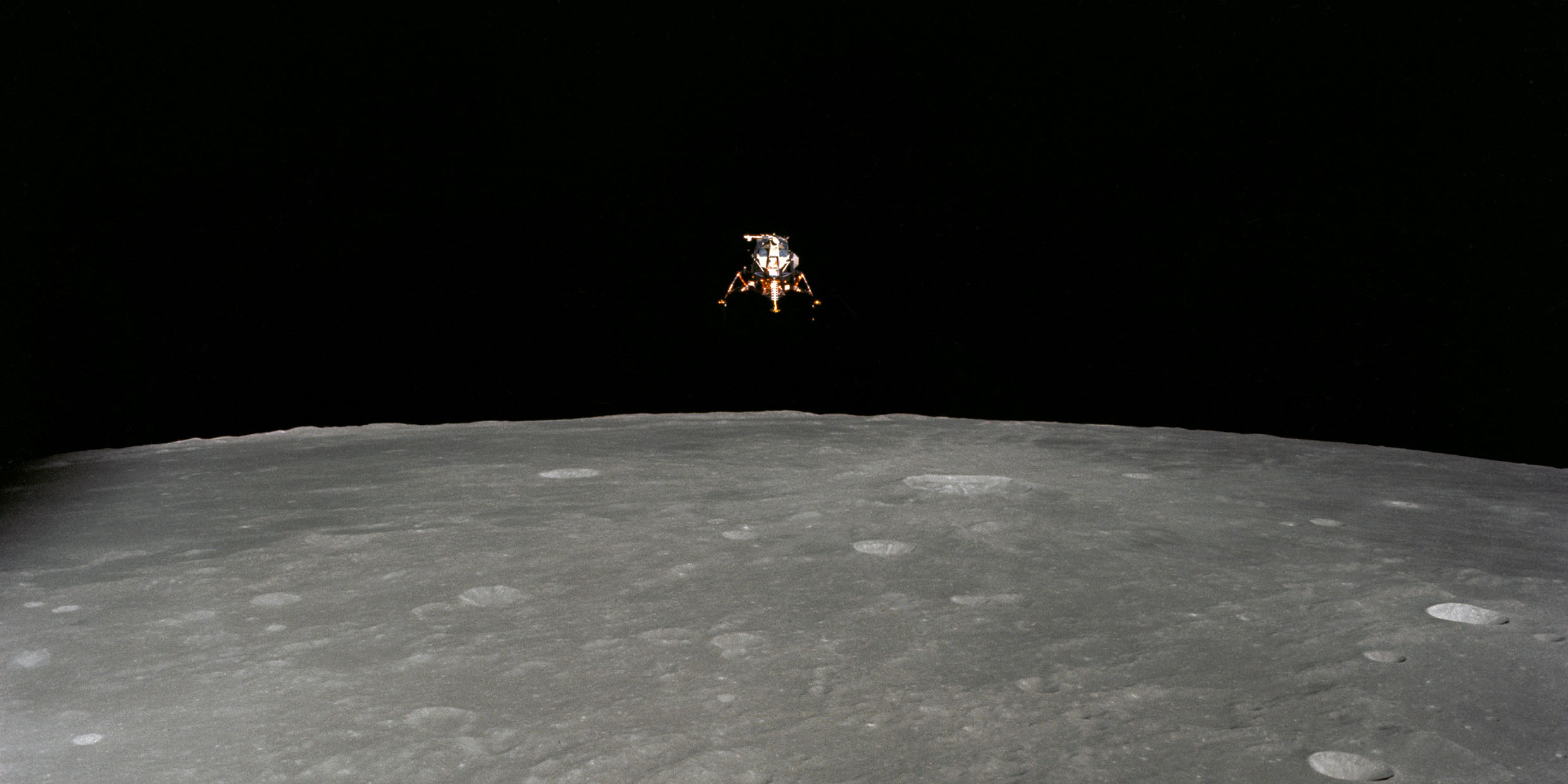 Image of an Apollo spacecraft flying over the surface of the Moon
