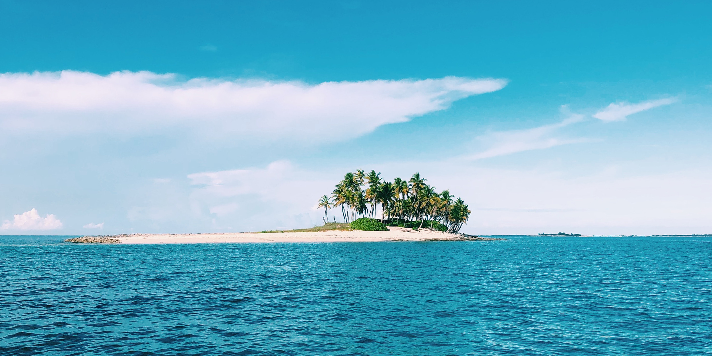 Image of a small Bahamian island barely rising above the sea