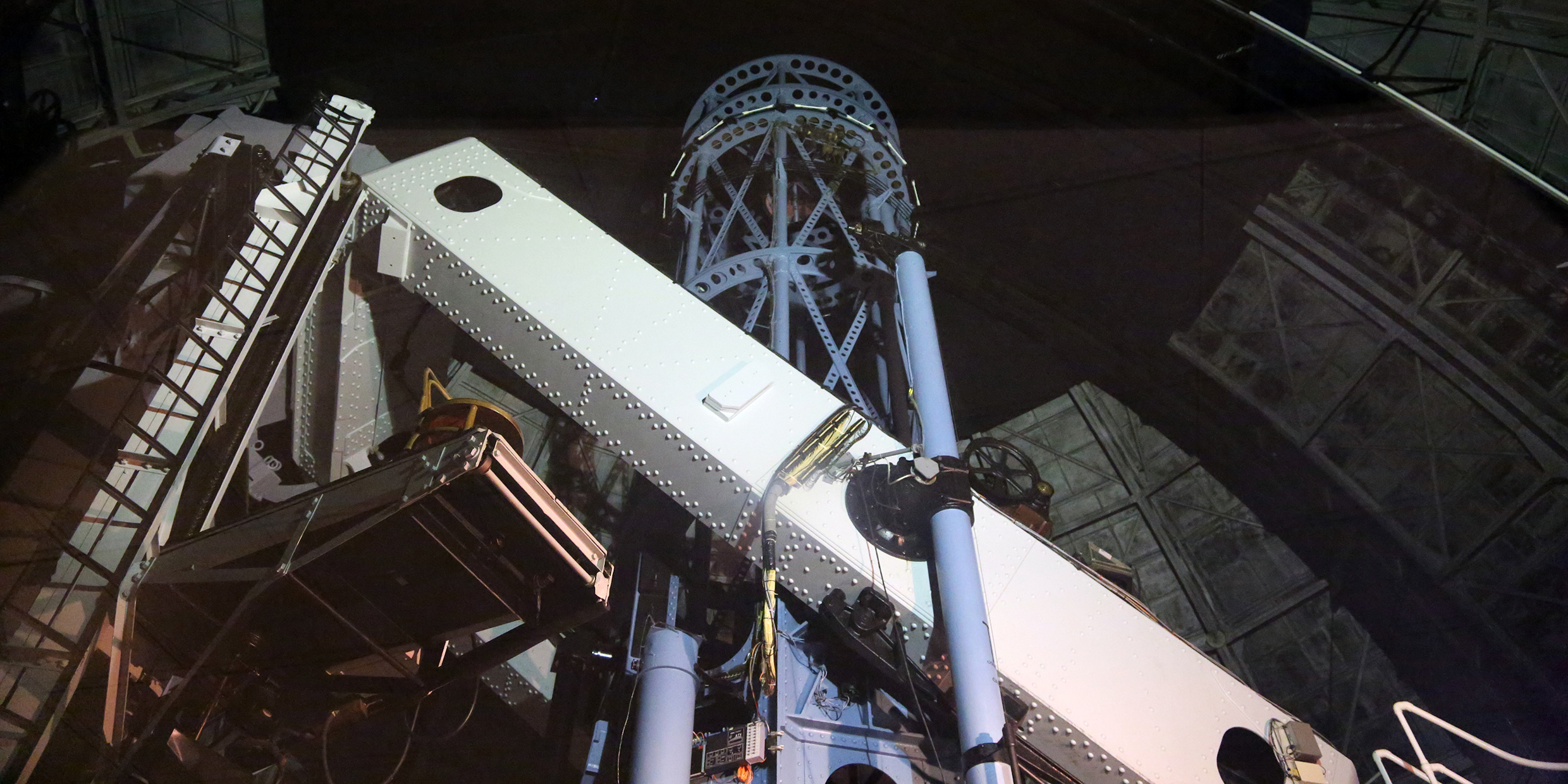 Image of a large telescope inside a domed observatory