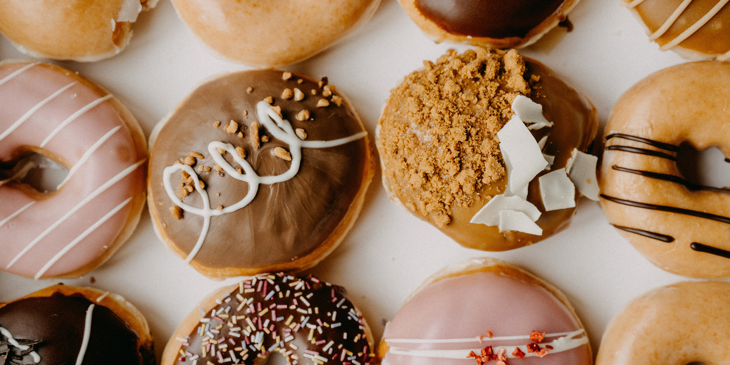 Image of an assortment of frosted doughnuts