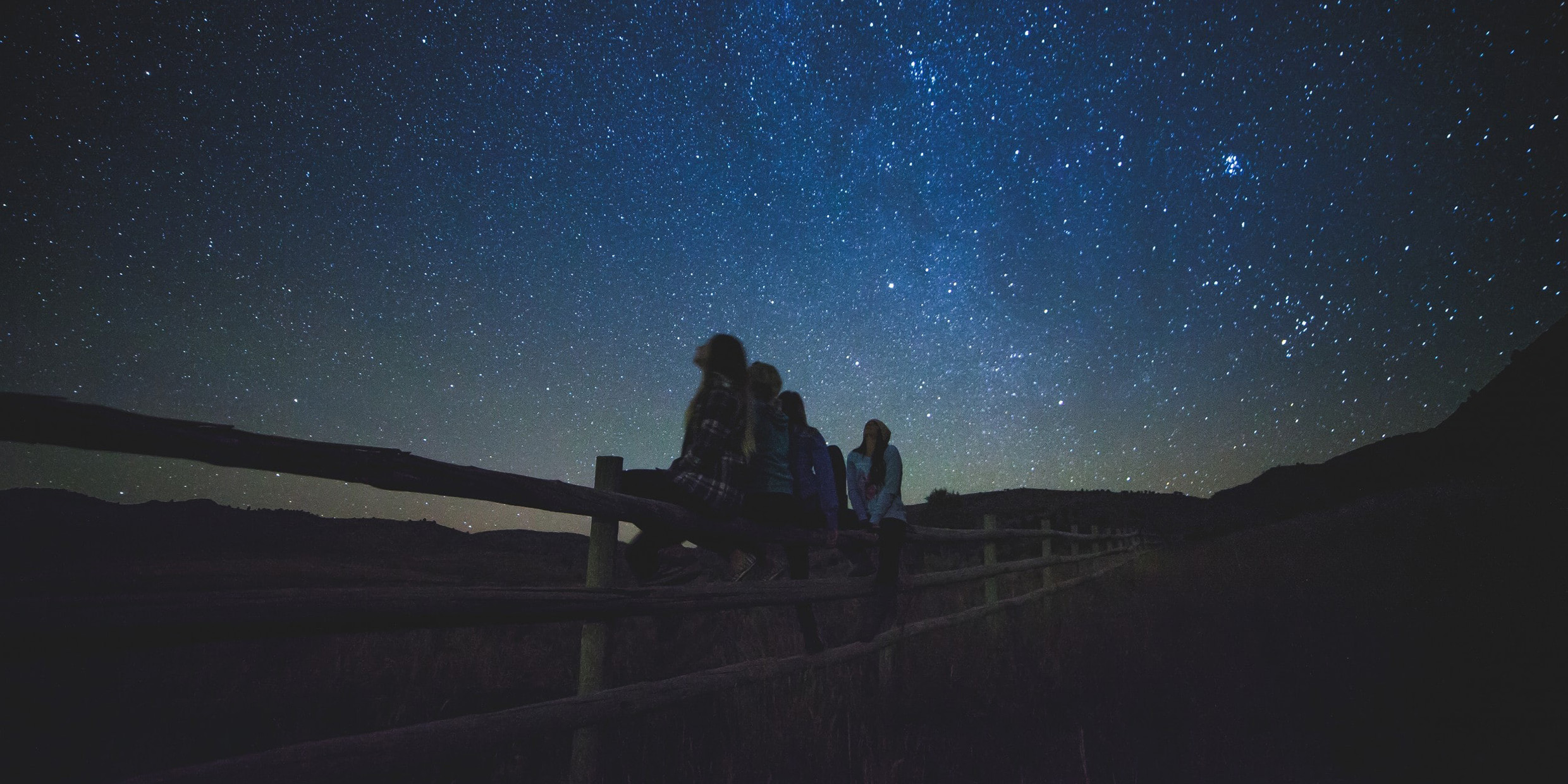 Image of a group of young people star-gazing.