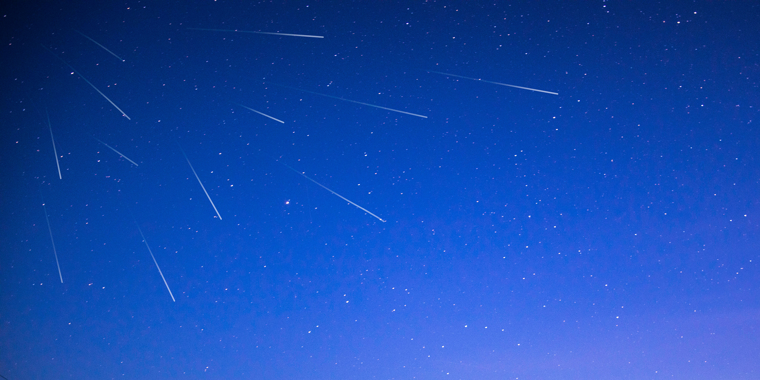 Image of a meteor-streaked night sky